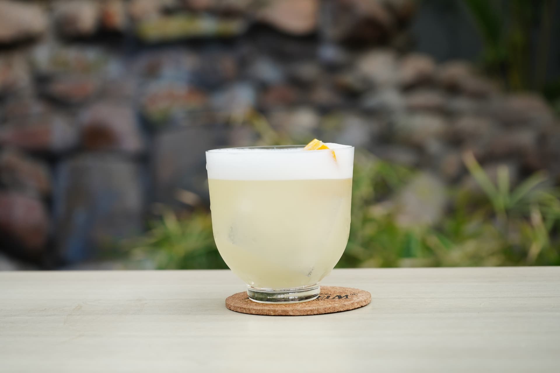 Silky pale sour crowned with foam and orange peel
