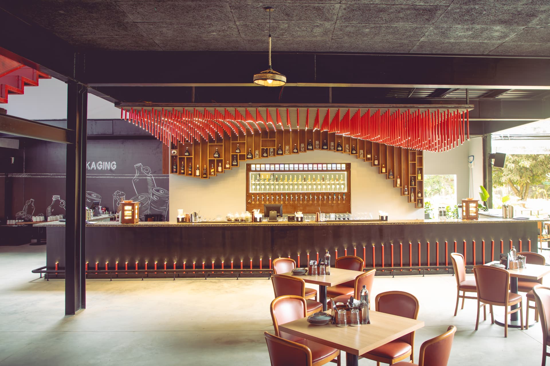 Long bar beneath the red light installation