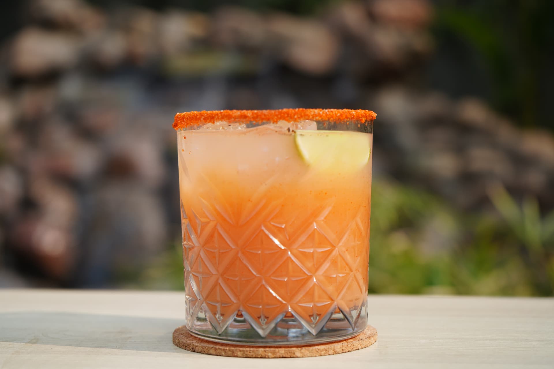 Chilli-salt rimmed cocktail with lime