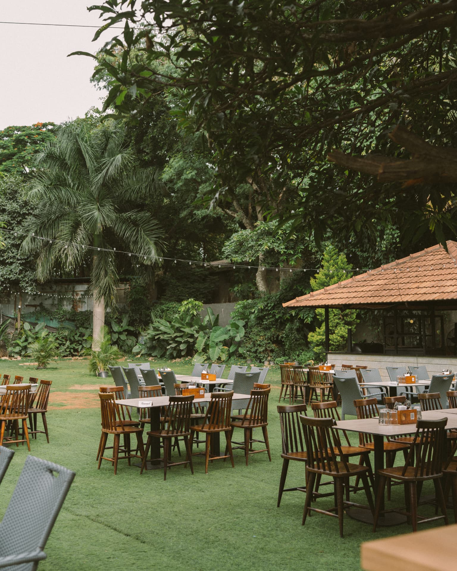 Terracotta cabana at the edge of the garden