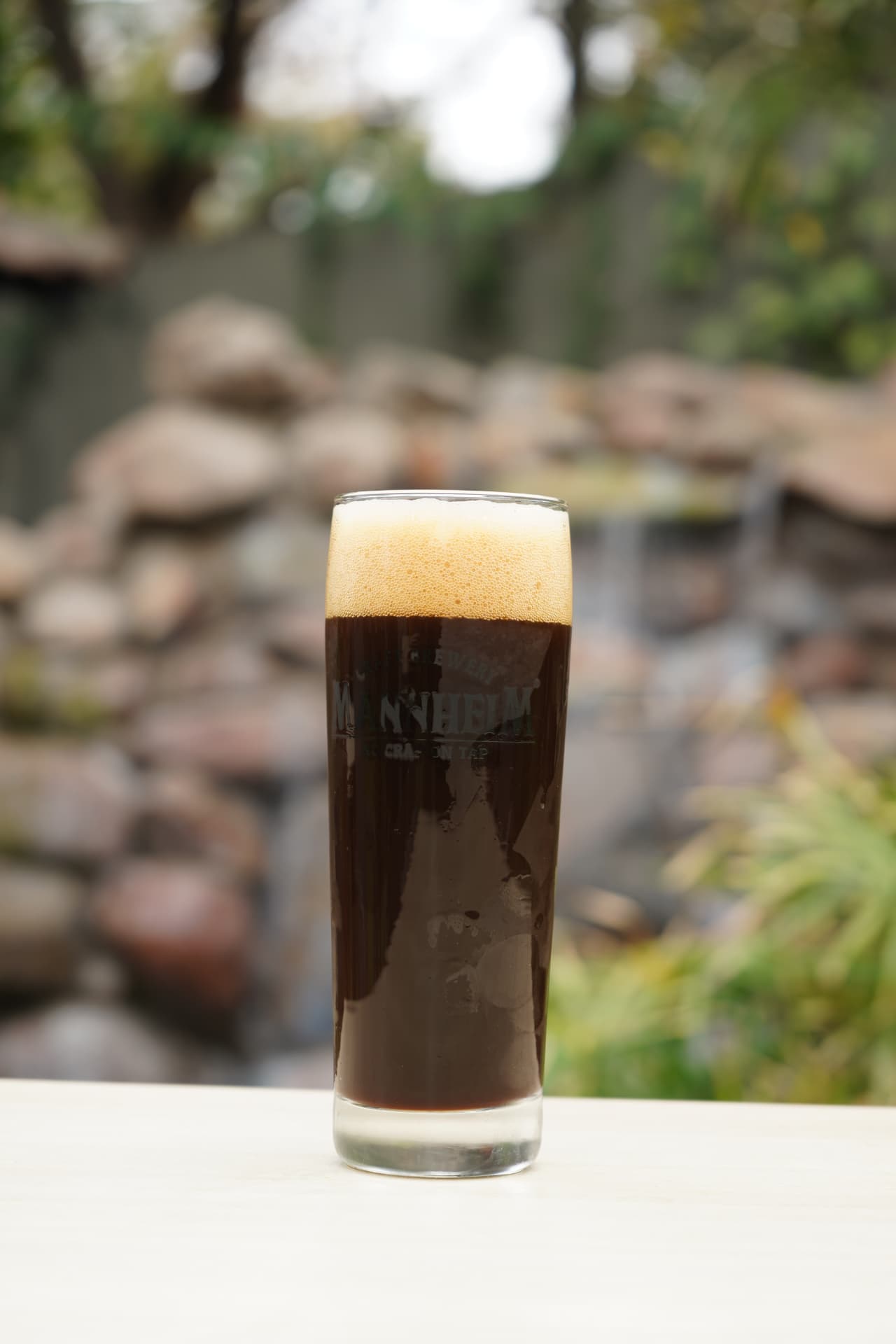 Mannheim dark beer with a dense foam head